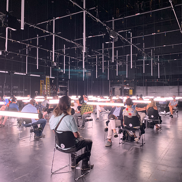 audience seated on stage during the production of blindness