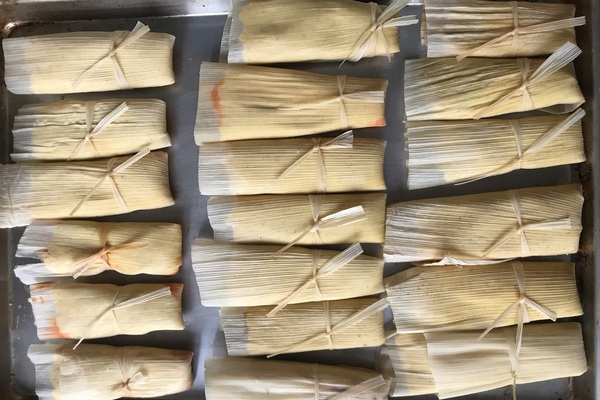 Tomales lined up on sheet pan.