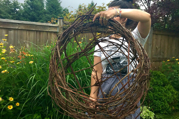 Woman holding basket wreath